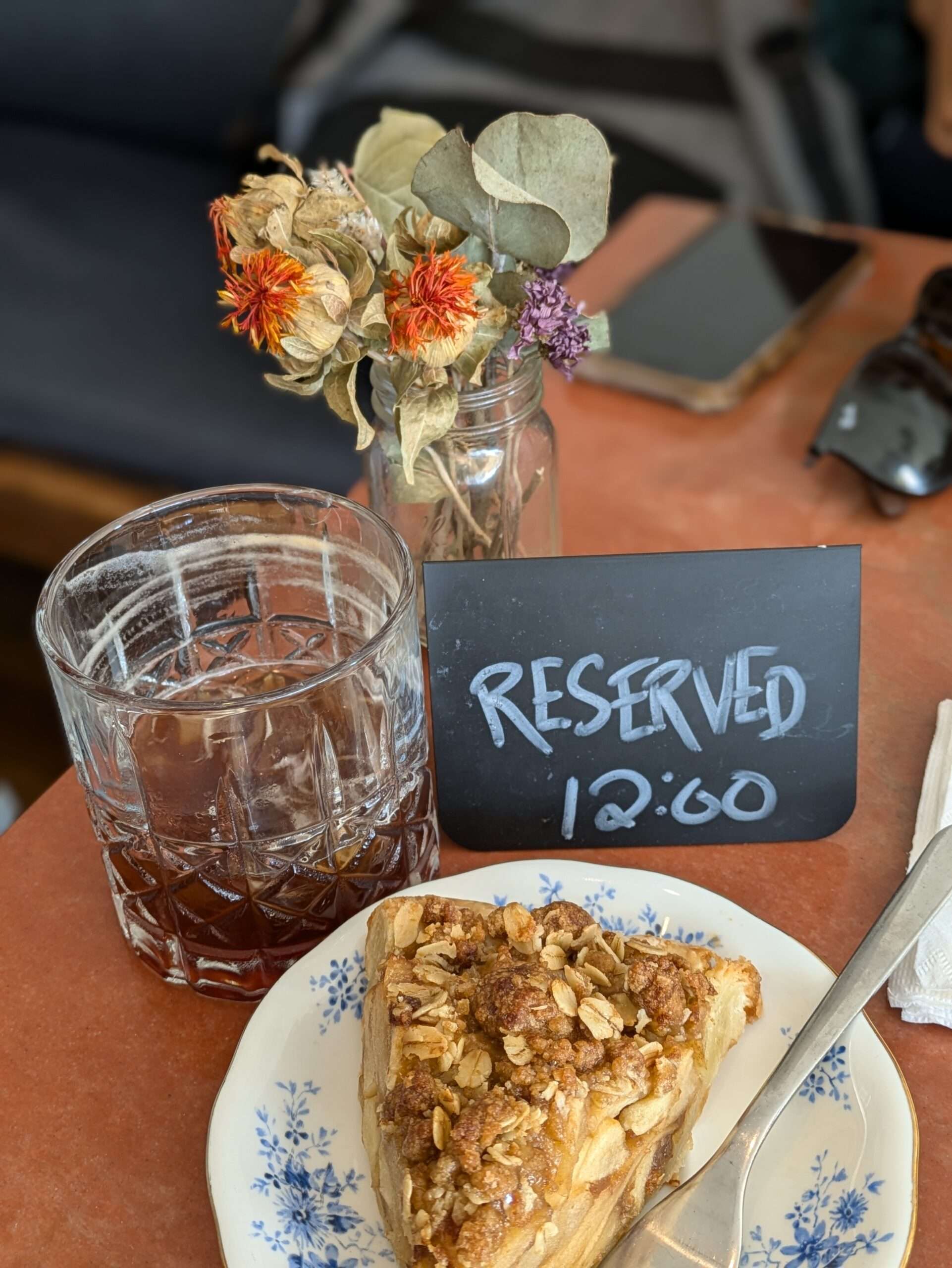 Table reserved for food tour with pie on it.