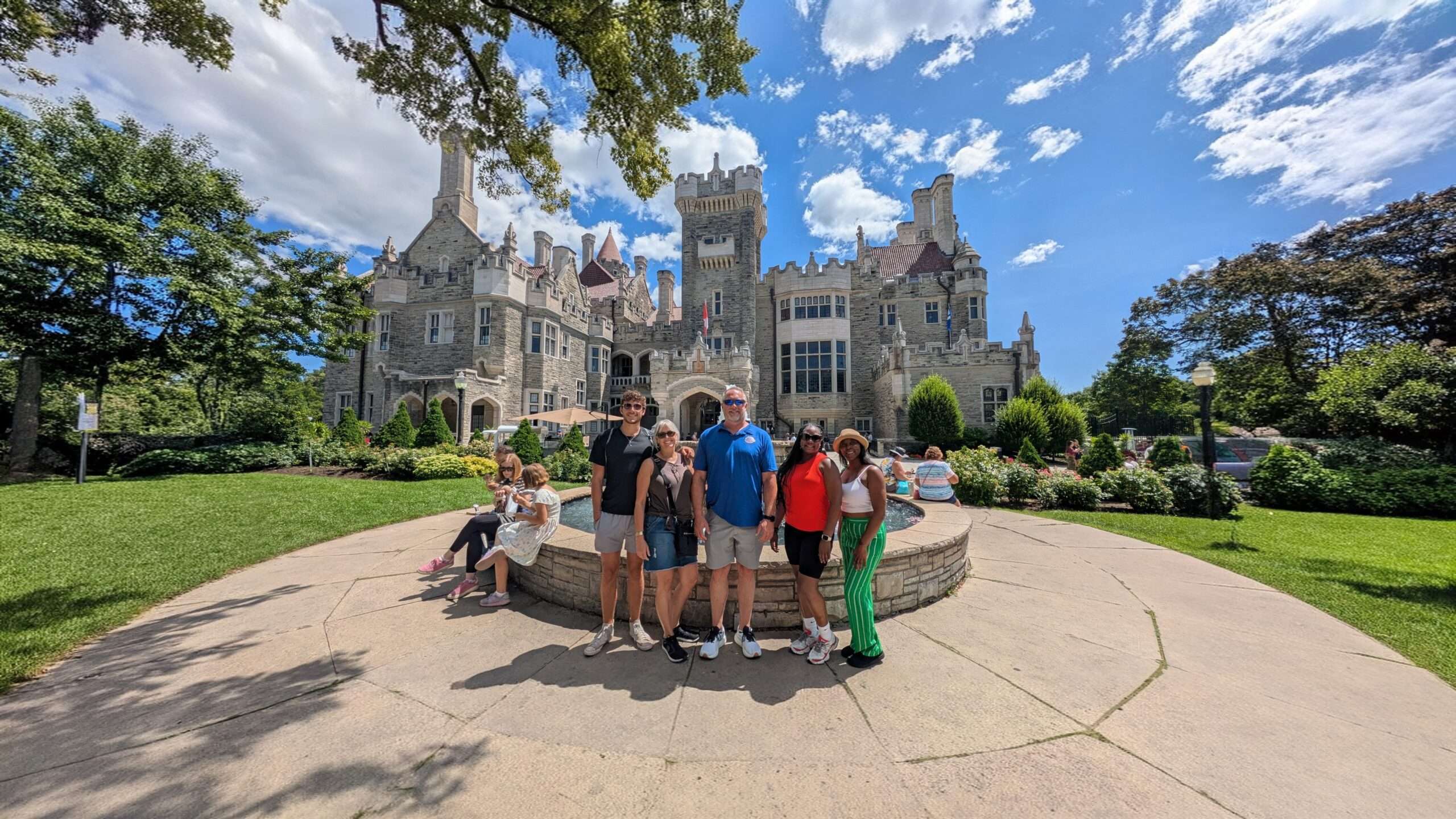 Food tour group posing in front of Casa Loma